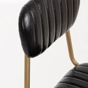 Addy silla retro moderna con estructura de acero de polipiel negra