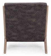 Sillón de piel sintética con cojín de estilo vintage.