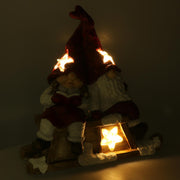 Resina LED Papá Noel con niño rojo cm40x26h15