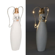 Ángel de resina blanca con led y corazón cm10x5h24