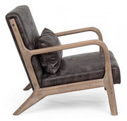 Sillón de piel sintética con cojín de estilo vintage.