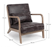 Sillón de piel sintética con cojín de estilo vintage.